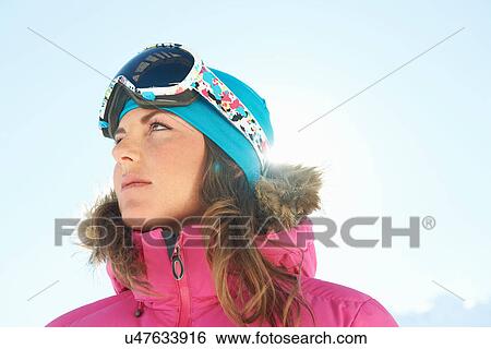 Stock Photograph - Portrait of a young female skier. Fotosearch