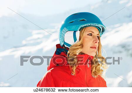 Stock Image - Portrait of a young female snowboarder. Fotosearch