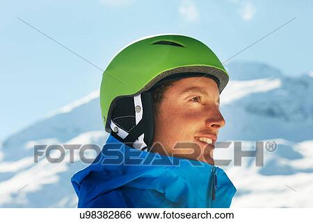 Stock Photograph - Portrait of a young male snowboarder. Fotosearch