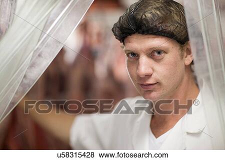 Portrait of butcher wearing hairnet, close up View Large Photo Image Stock Photo - Portrait of butcher wearing hairnet, close up. Fotosearch