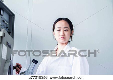 Portrait of female scientist using lab equipment View Large Photo Image Stock Photograph - Portrait of female scientist using lab equipment. Fotosearch