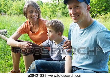 Portrait of parents and son outdoors View Large Photo Image Stock Image - Portrait of parents and son outdoors. Fotosearch