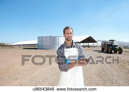 Portrait of worker on dairy farm View Large Photo Image Stock Photograph - Portrait of worker on dairy farm. Fotosearch