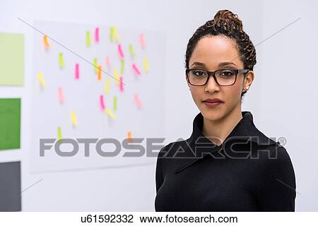 Stock Image - Portrait of young female designer. Fotosearch
