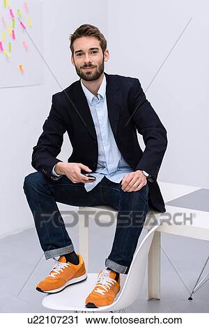 Stock Image - Portrait of young male in design studio. Fotosearch