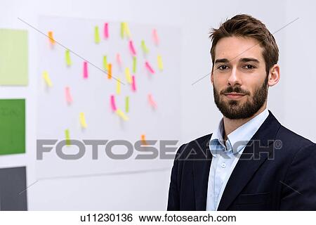 Portrait of young man in design studio View Large Photo Image Stock Photograph - Portrait of young man in design studio. Fotosearch