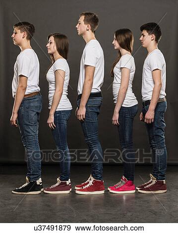 Stock Photo - Profile of five teenagers standing in a group. Fotosearch