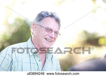 Stock Photograph - Senior man outdoors, smiling. Fotosearch