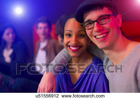 Teenage couple at party, friends in background View Large Photo Image Stock Image - Teenage couple at party, friends in background. Fotosearch