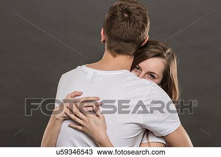 Teenage couple hugging View Large Photo Image Stock Image - Teenage couple hugging. Fotosearch