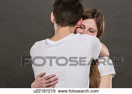 Teenage couple hugging View Large Photo Image Stock Photo - Teenage couple hugging. Fotosearch