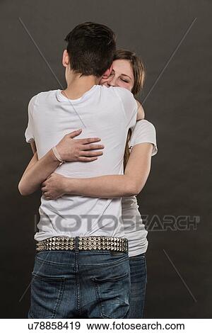 Stock Photo - Teenage couple hugging. Fotosearch