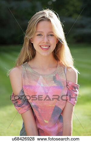 Stock Photo - Teenage girl smiling, portrait. Fotosearch