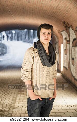 Teenager standing in underpass View Large Photo Image Picture - Teenager standing in underpass. Fotosearch
