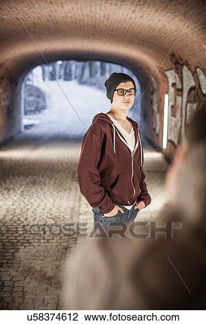 Teenager standing in underpass View Large Photo Image Stock Image - Teenager standing in underpass. Fotosearch