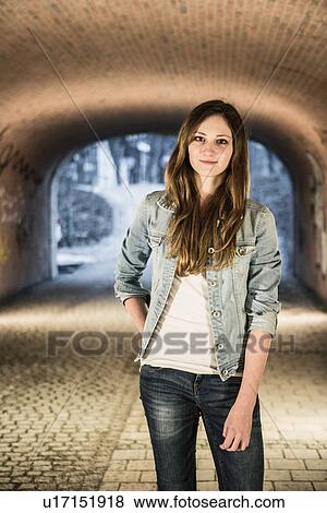 Stock Photo - Teenager standing in underpass. Fotosearch