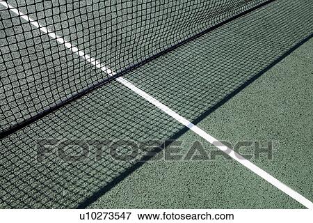 Stock Photo - Tennis net on court at day time. Fotosearch