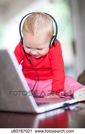 Toddler girl wearing telephone headset View Large Photo Image Stock Image - Toddler girl wearing telephone headset. Fotosearch