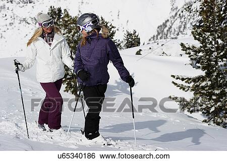 Two female skiers View Large Photo Image Stock Photograph - Two female skiers. Fotosearch