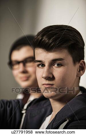 Stock Photo - Two teenage boys, focus on foreground. Fotosearch