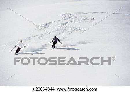 Two women skiing View Large Photo Image Picture - Two women skiing. Fotosearch