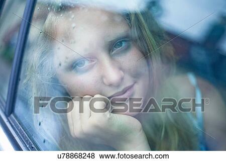 View of girl in a car View Large Photo Image Stock Photo - View of girl in a car. Fotosearch