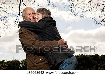 Wife hugging husband round neck View Large Photo Image Stock Image - Wife hugging husband round neck. Fotosearch
