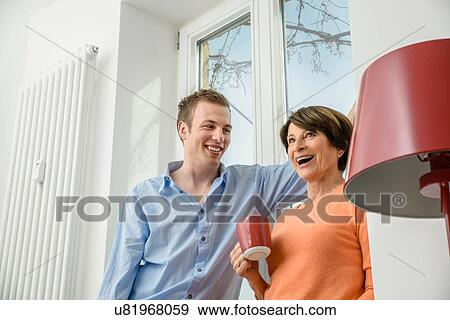 Stock Photo - Woman and grown up son talking. Fotosearch