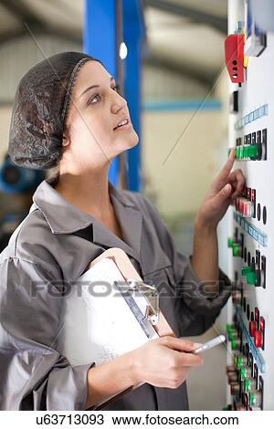 Woman at control panel in olive processing plant View Large Photo Image Stock Image - Woman at control panel in olive processing plant. Fotosearch