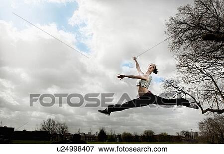 Woman doing ballet leap View Large Photo Image Stock Photo - Woman doing ballet leap. Fotosearch