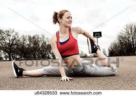 Woman doing splits with left leg bent backwards View Large Photo Image Stock Image - Woman doing splits with left leg bent backwards. Fotosearch