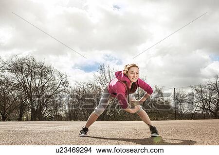Woman doing stretching exercise View Large Photo Image Picture - Woman doing stretching exercise. Fotosearch