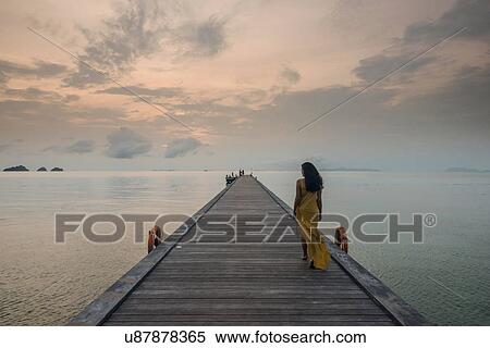 Woman on pier, Taling Ngam Beach, Ko Samui, Thailand View Large Photo Image Stock Photography - Woman on pier, Taling Ngam Beach, Ko Samui, Thailand. Fotosearch
