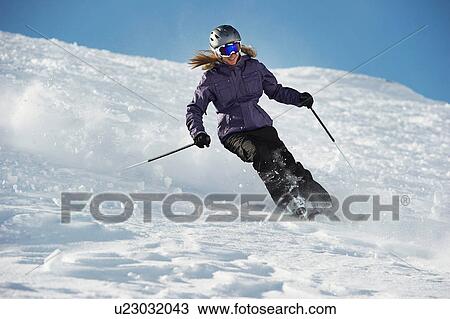 Woman skiing View Large Photo Image Stock Image - Woman skiing. Fotosearch