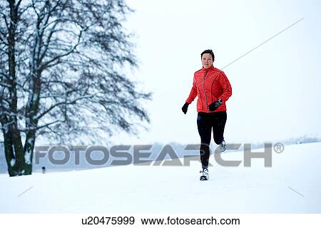 Woman snow running View Large Photo Image Stock Photo - Woman snow running. Fotosearch
