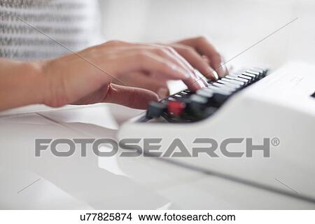 Picture - Woman using typewriter, close up. Fotosearch