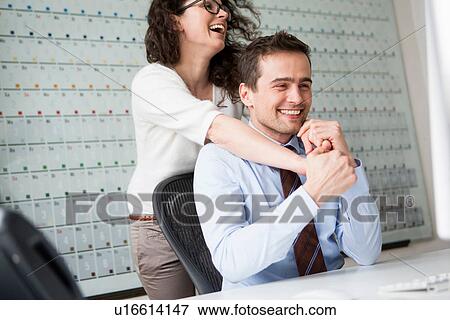 Woman with arms around neck of man wearing shirt and tie View Large Photo Image Stock Photo - Woman with arms around neck of man wearing shirt and tie. Fotosearch