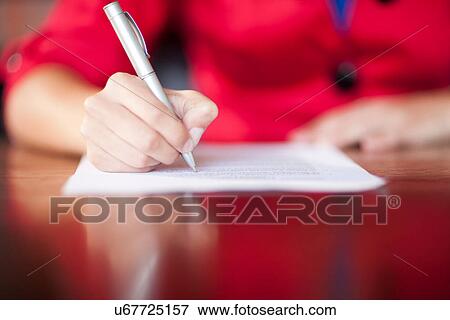 Woman writing, close up View Large Photo Image Stock Photo - Woman writing, close up. Fotosearch