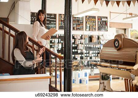 Stock Photo - Women working in craft shop. Fotosearch