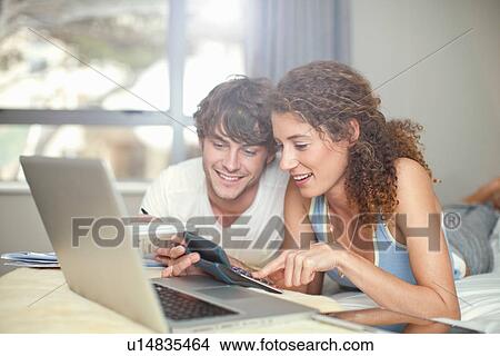 Picture - Young couple planning finances. Fotosearch