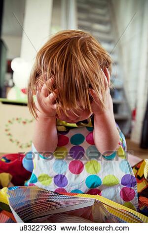 Young girl with head in hands View Large Photo Image Stock Image - Young girl with head in hands. Fotosearch