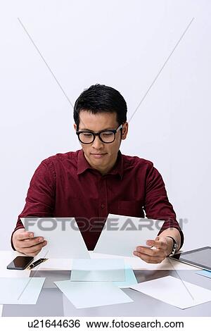 Young male designer looking at color samples View Large Photo Image Stock Photograph - Young male designer looking at color samples. Fotosearch