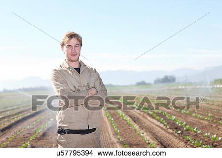 Young man in potato field, portrait View Large Photo Image Picture - Young man in potato field, portrait. Fotosearch