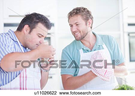 Young man smelling ingredients View Large Photo Image Stock Image - Young man smelling ingredients. Fotosearch