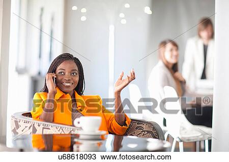 Young woman on cell phone View Large Photo Image Stock Image - Young woman on cell phone. Fotosearch