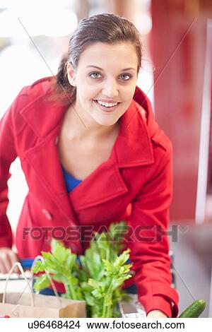 Young woman shopping View Large Photo Image Picture - Young woman shopping. Fotosearch