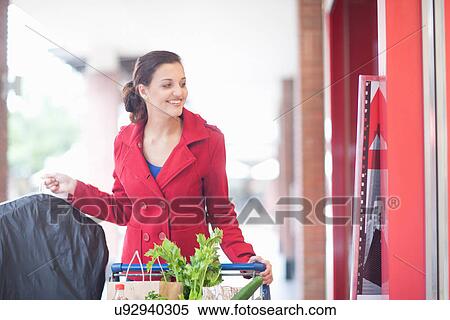 Stock Photography - Young woman shopping. Fotosearch
