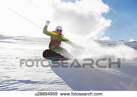 Young woman snowboarding View Large Photo Image Stock Photo - Young woman snowboarding. Fotosearch