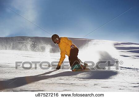 Young woman snowboarding View Large Photo Image Stock Photograph - Young woman snowboarding. Fotosearch