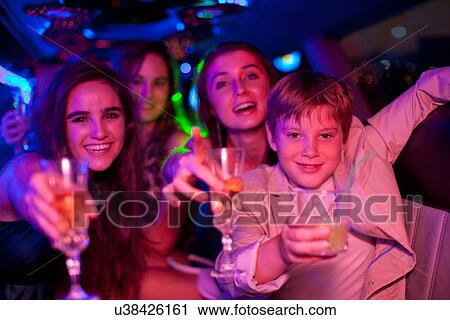 Young women and boy in limousine View Large Photo Image Stock Image - Young women and boy in limousine. Fotosearch